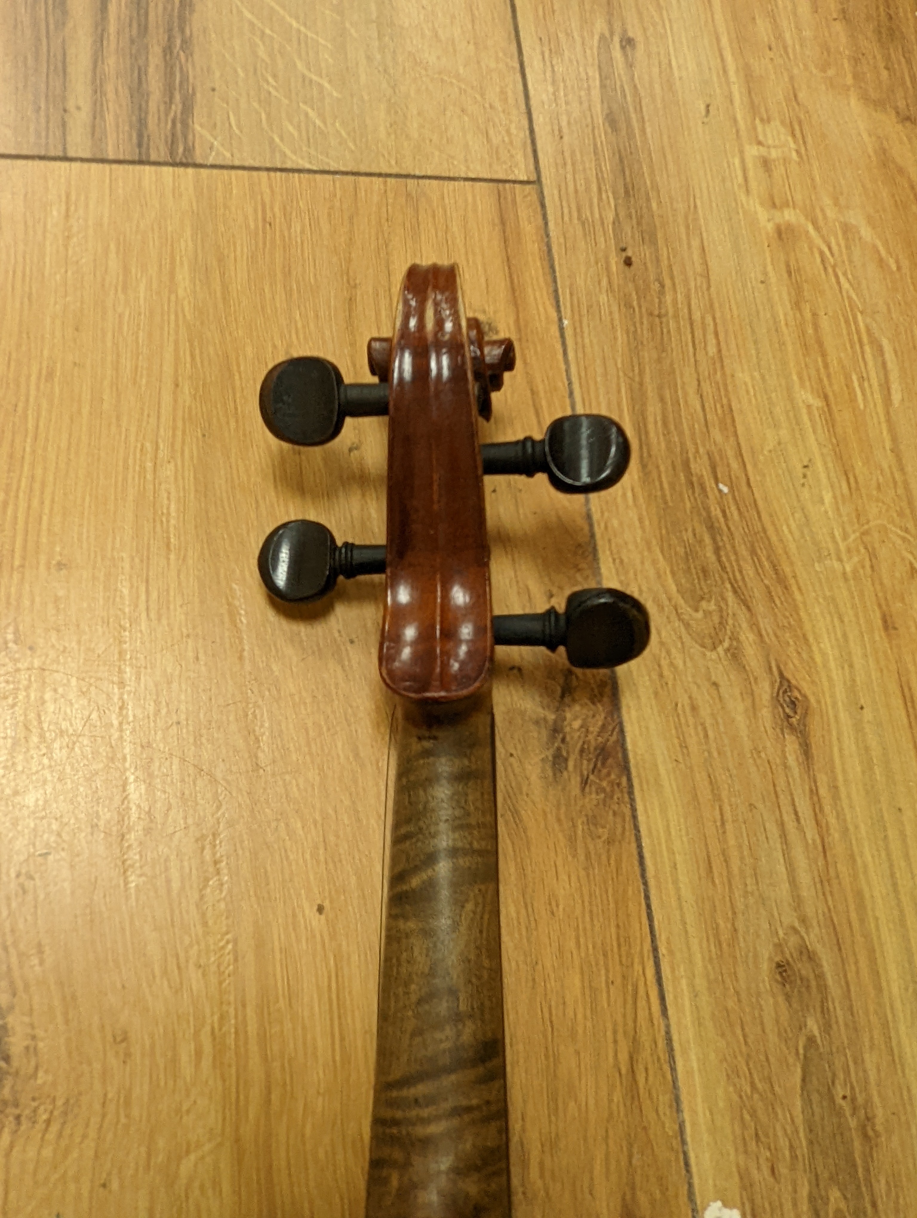 An early 20th century French vioilin, cased with bow and a cased saxon violin